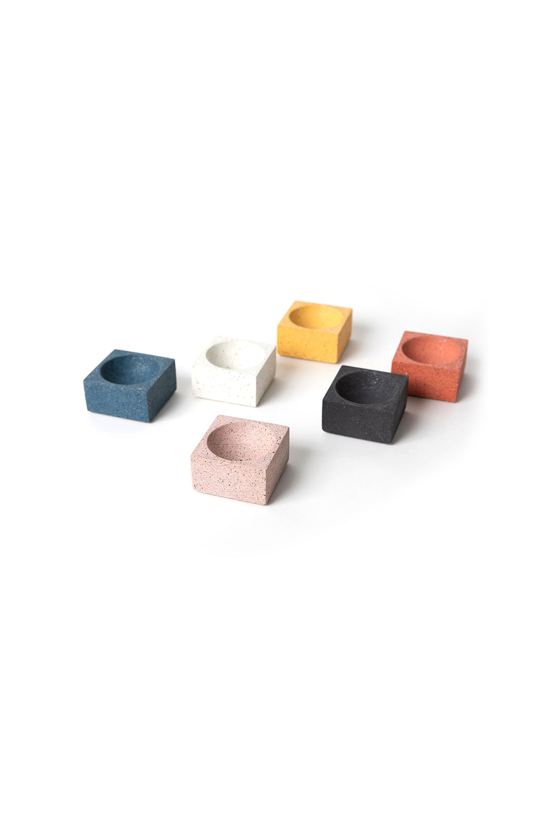Group of concrete incense holders by Pretti.Cool. Marigold, Coral, Black, Cobalt Blue, and White Terazzo square incense holders for incense sticks or cones. 