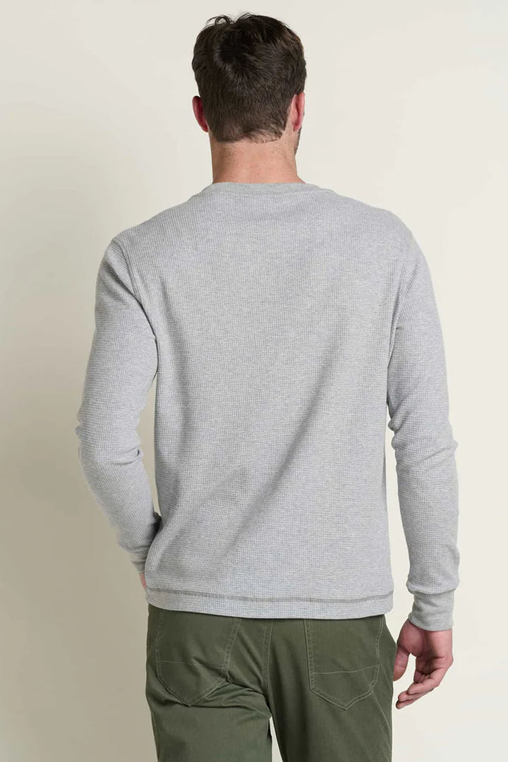 Rear view of man wearing a heather grey henley shirt. 