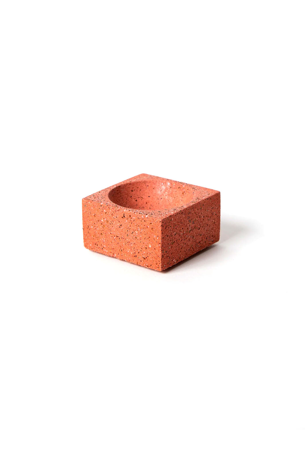 Coral concrete terrazzo square incense holder with a rounded inset center for the incense stick or cone